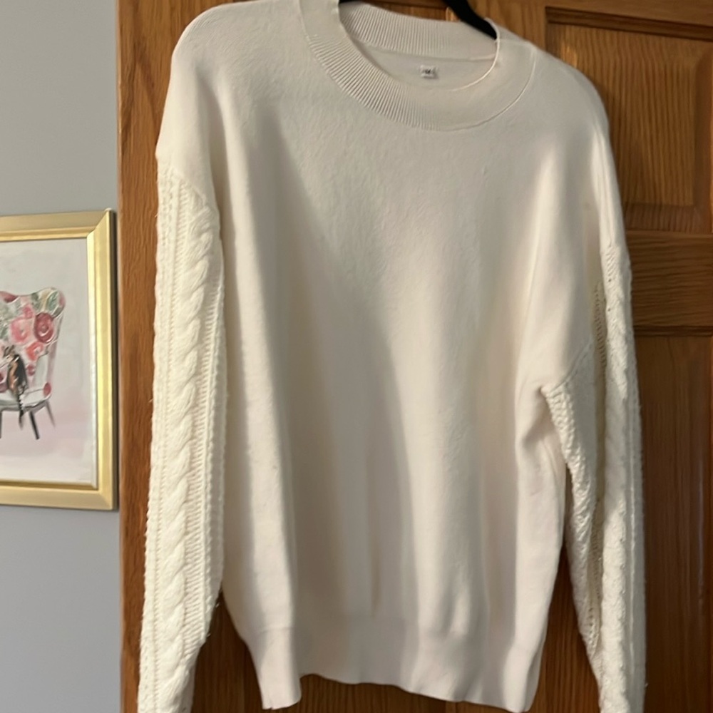 Off white sweater with cable knit sleeves. Super  cozy